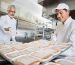 Volunteer chefs preparing frozen meals for food bank